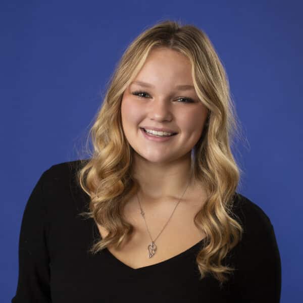 Jones family ortho what to expect Smiling girl infront of blue background