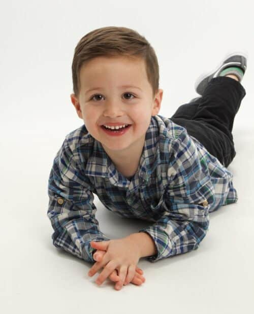 Jones003814255-005 Young child smiling on floor