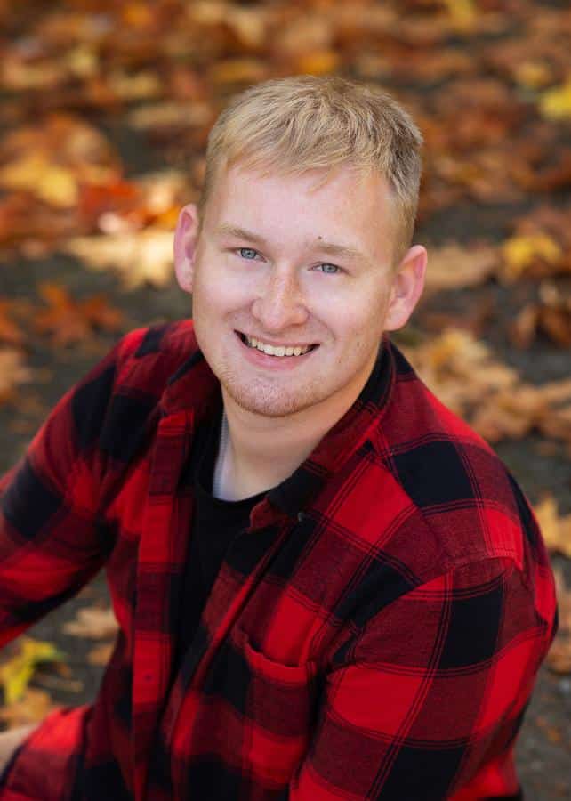 Jones-family-orthodontics-autumn–happy-man-straight-smile Photo of man smiling outside