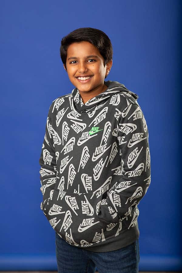 Jones family orthodontics-1-patient photo Patient photo young boy on dark blue background