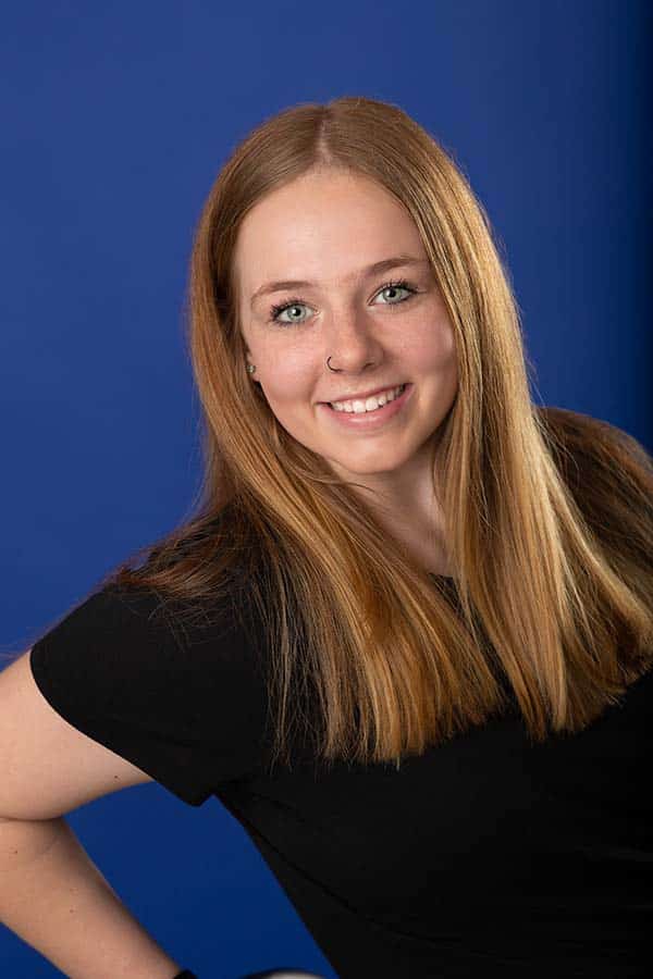 Jones family orthodontics-4-patient photo Patient photo girl on dark blue background