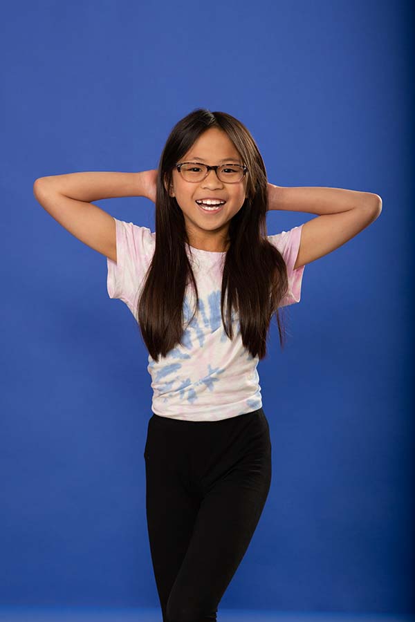 Jones family orthodontics-5-patient photo Patient photo young girl on dark blue background