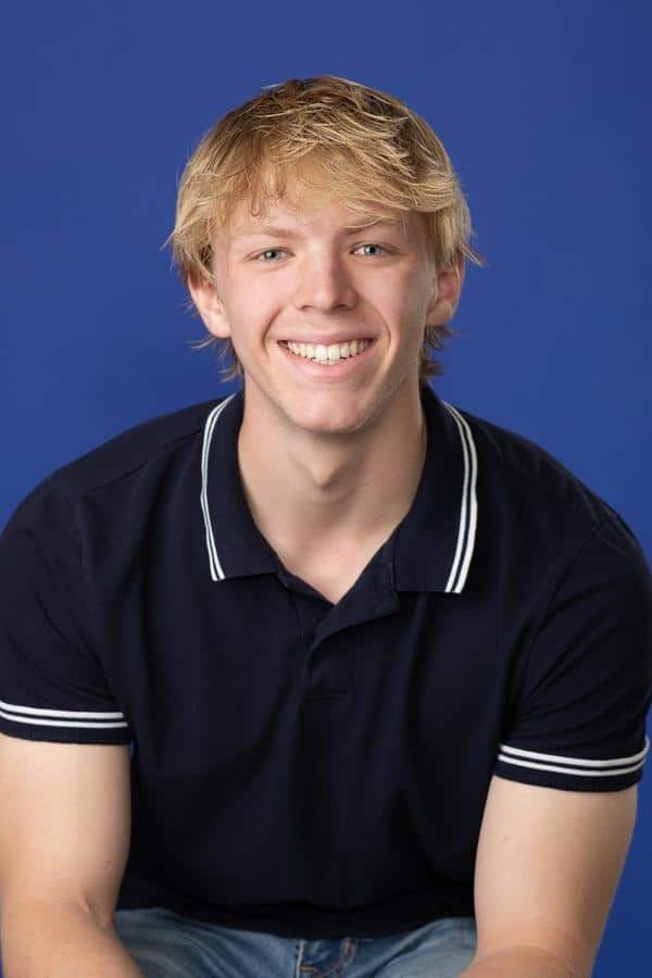 Orthodontic-patient-after-treatment-smiling-straight-teeth Teenage male patient after orthodontic treatment smiling with straight teeth