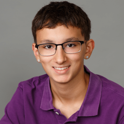 Teenage boy patient smiling, representing benefits of braces for teens