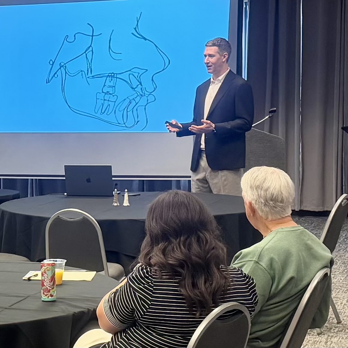 Jones family orthodontics timeline 18 Dr. Jones sharing his orthodontic expertise with fellow professionals during a continuing education session in arizona
